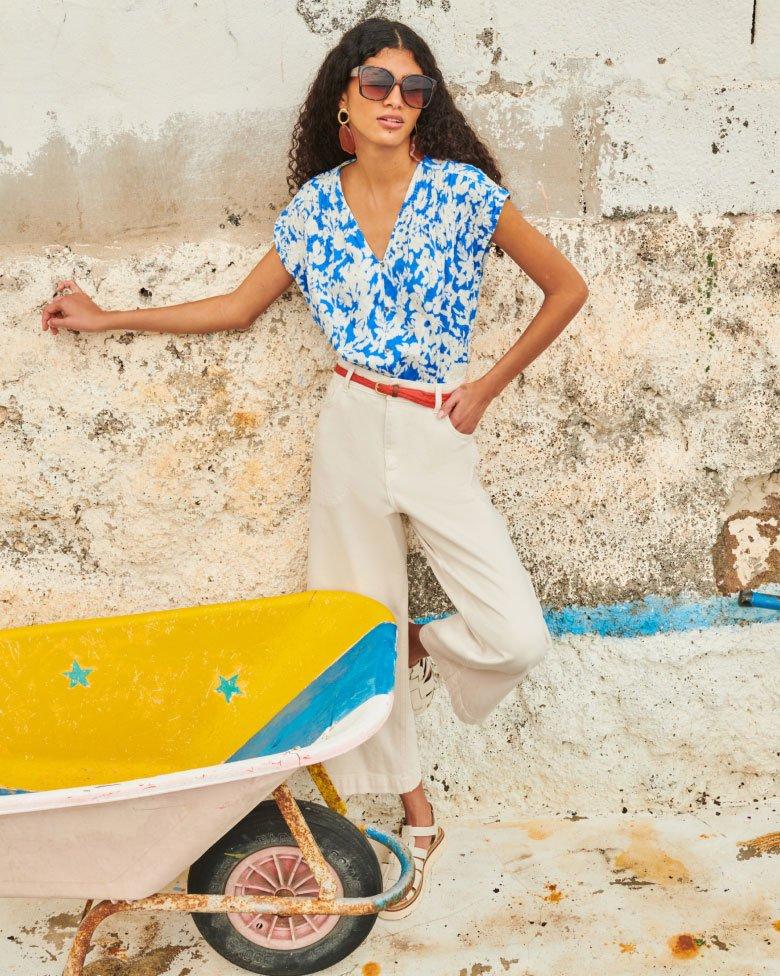 woman in printed cotton shirt and trousers